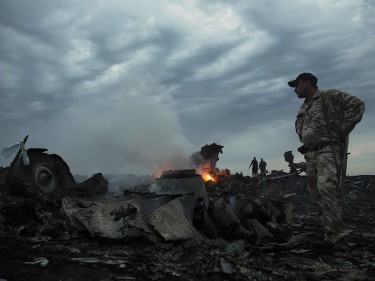 Smoke rises up at a crash site of a passenger plane, near the village of Grabovo, Ukraine (AP)