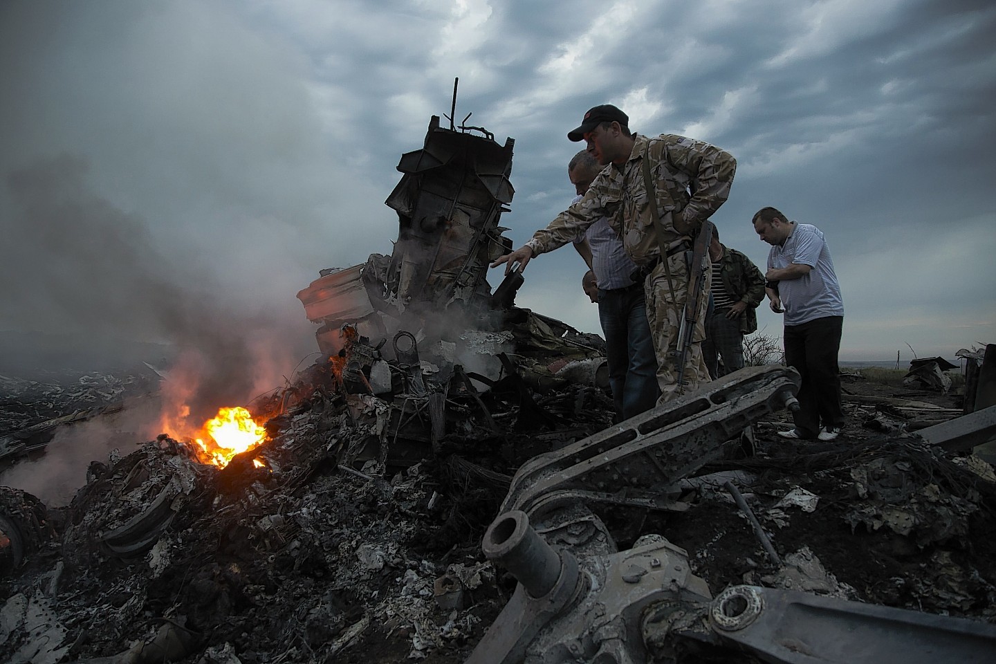 Smoke rises up at a crash site of a passenger plane, near the village of Grabovo, Ukraine (AP)