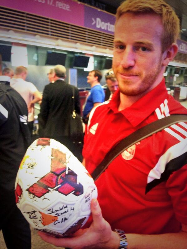 Adam Rooney with the match ball at Riga Airport