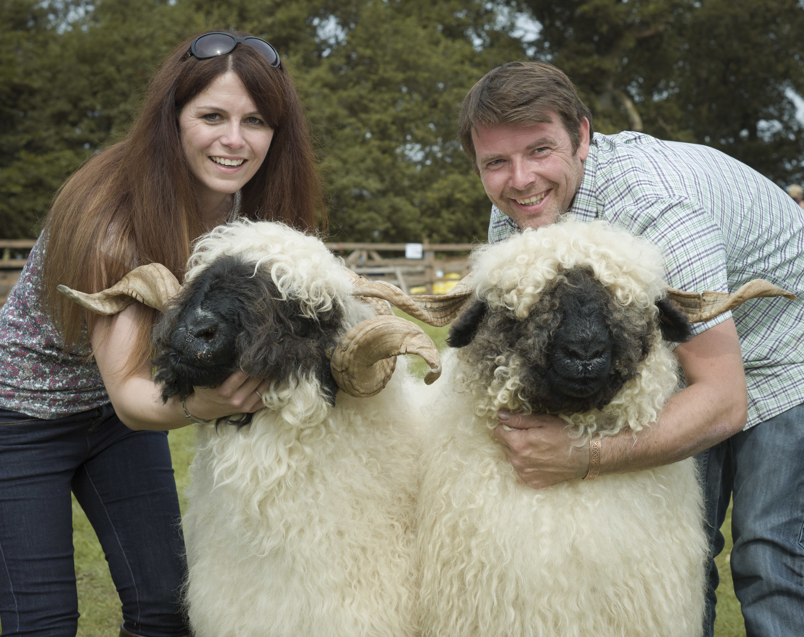 Jenni McAllister and Raymond Irvine holding a couple of their sheep.