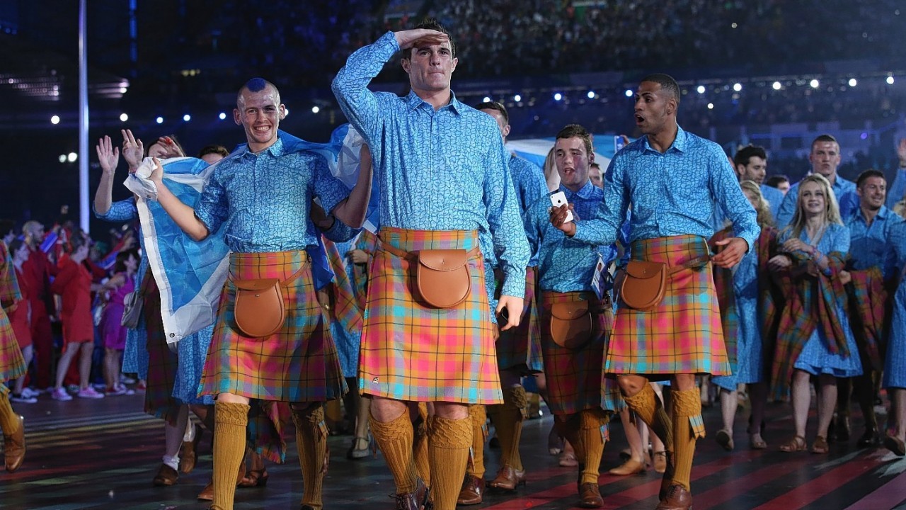 The athletes arrive at Celtic Park during last night's opening ceremony