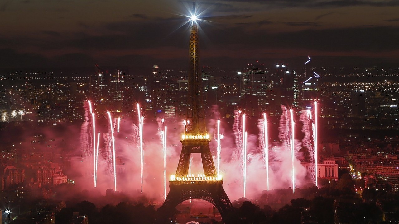 Fireworks illuminate the Eiffel Tower in Paris during Bastille Day celebrations, Monday, July 14, 2014.