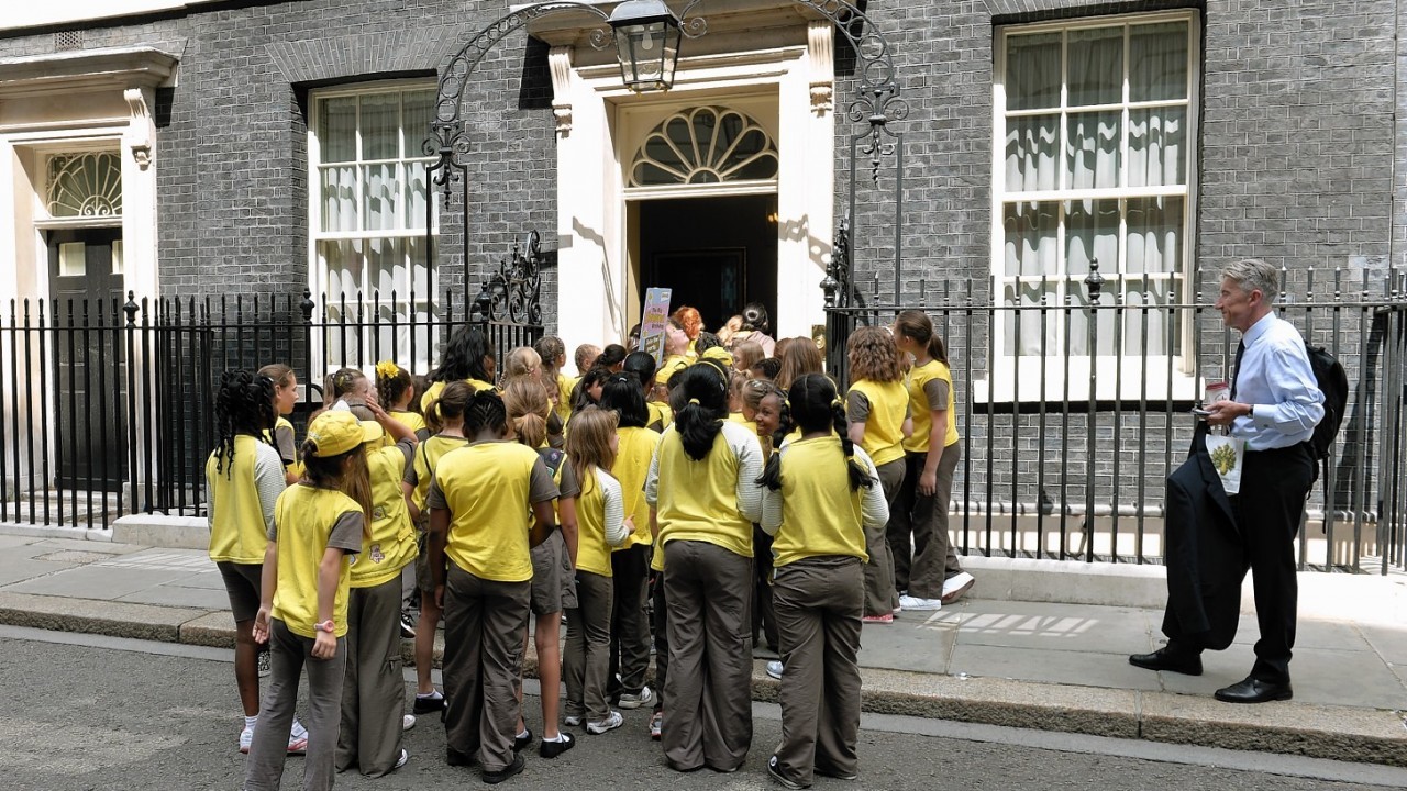 Brownies arrive for a reception hosted by the Prime Minister David Cameron to celebrate the centenary of the Brownies, Downing Street, central London