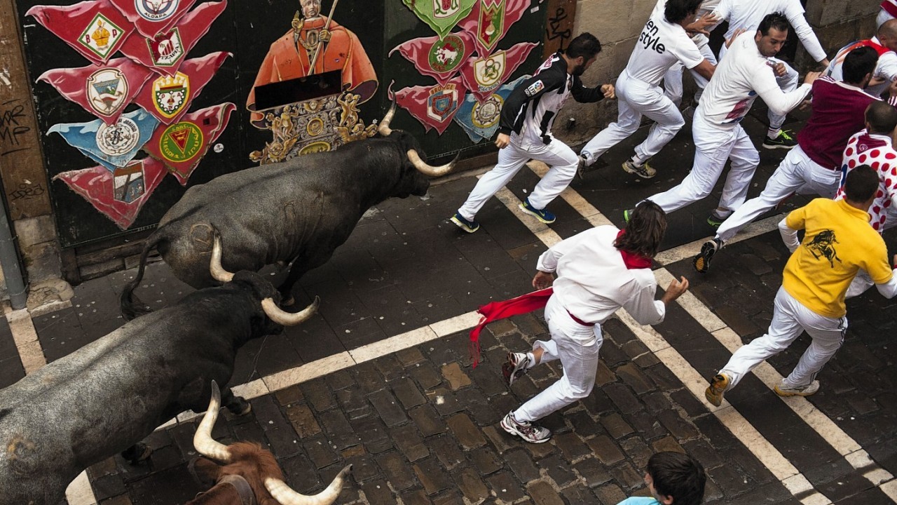 The running of the bulls of the San Fermin festival, in Pamplona, Spain, Sunday, July 13, 2014
