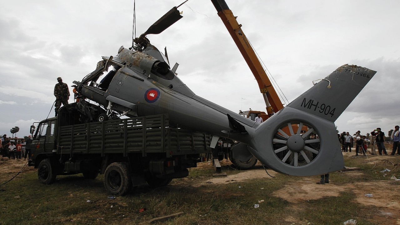 A helicopter crashes in Prey Sar village at the outskirt of Phnom Penh, Cambodia, Monday, July 14,