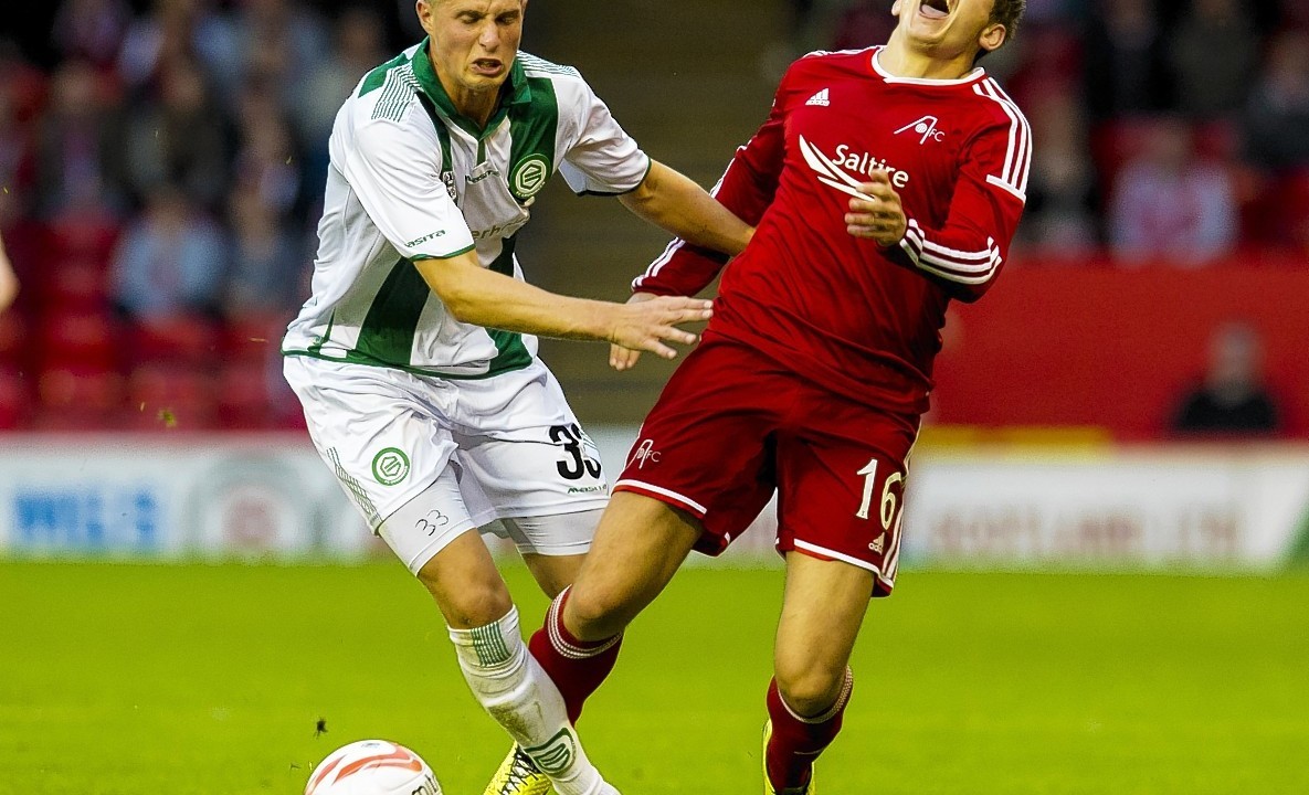 Aberdeen's Peter Pawlett is tackled by Hans Hateboer
