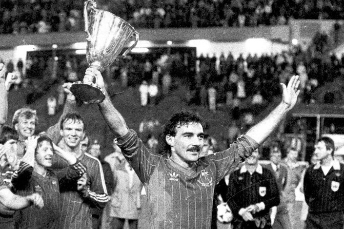 Captain Willie Miller proudly holds aloft the Cup Winners Cup after the famous victory