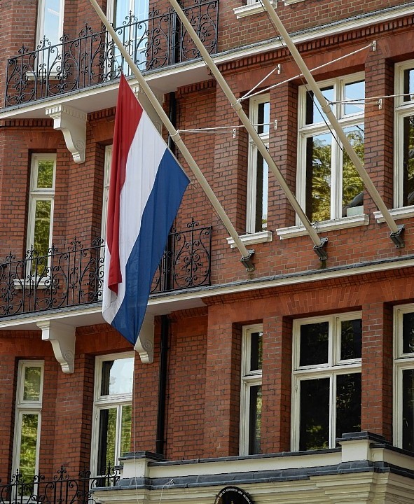 The flag at the Dutch Embassy in London is flown at half mast to remember the passengers who were killed on Malaysian Flight MH17 which crashed in Ukraine yesterday, as it travelled from Amsterdam to Kuala Lumpur