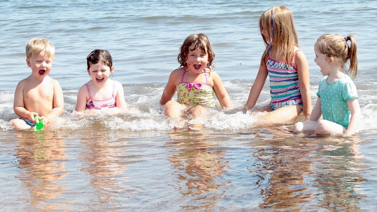 People enjoy a bright sunny day on Portobello beach near Edinburgh. July 22 2014