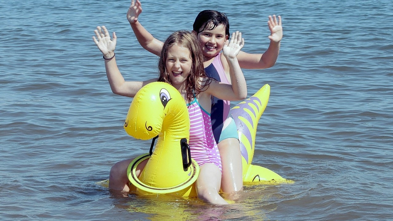 People enjoy a bright sunny day on Portobello beach near Edinburgh.