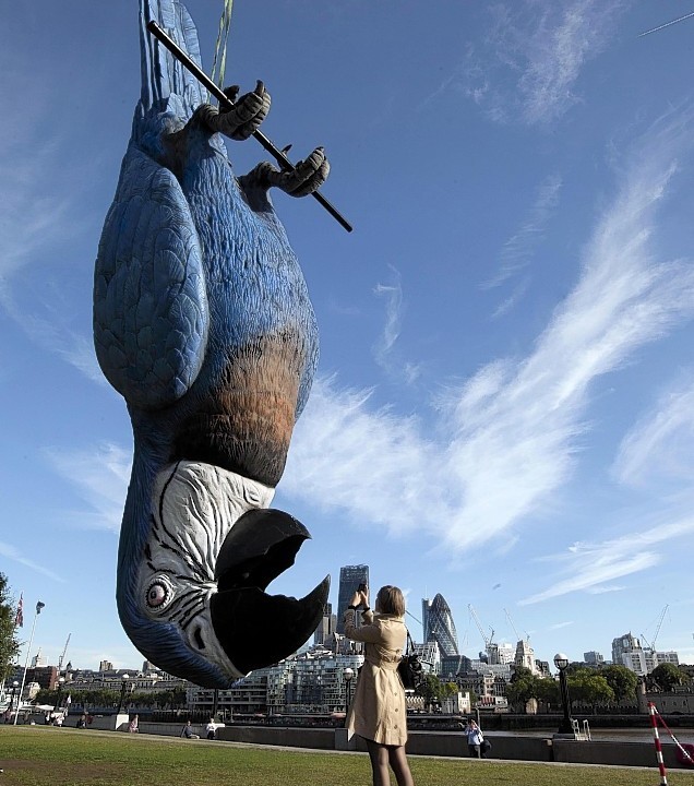 A giant dead parrot measuring 15 metres is unveiled on London's South Bank to promote the live broadcast of the final Monty Python Live stage show, Sunday 20 July.