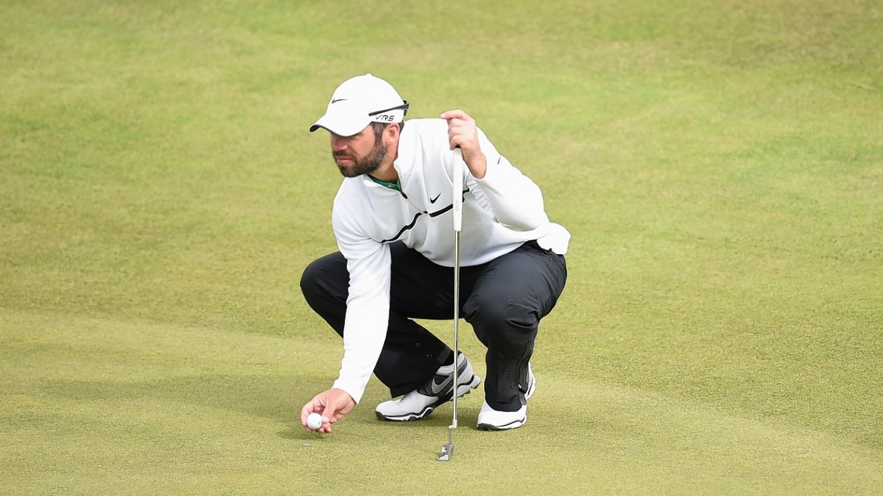 England's Paul Casey respots his ball during round one at Royal Aberdeen