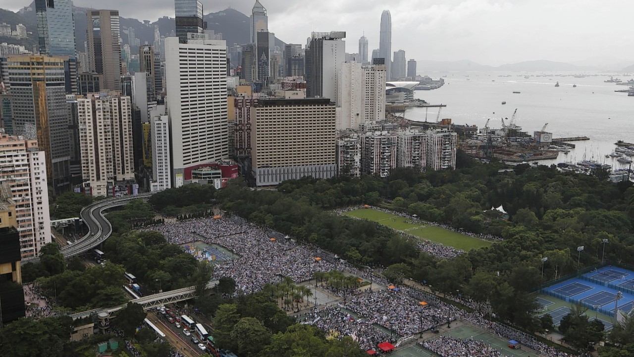 People march on a street during the annual pro-democracy protest on July 1, 2014 in Hong Kong