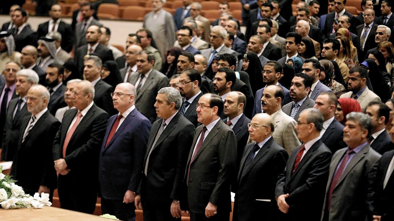 Iraqi newly elected parliament members attend the first session of parliament in the heavily fortified Green Zone in Baghdad, Iraq,
