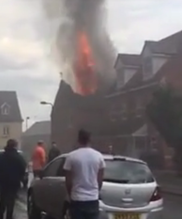 A house roof is engulfed by flames as lightning strikes Sheffield