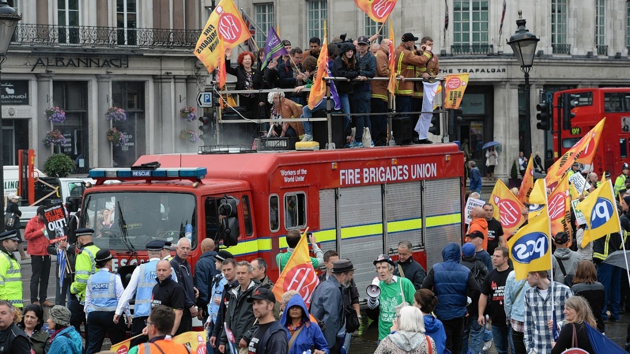 Public sector workers in Trafalgar Square, London, as they take part in the one-day walkout as part of bitter disputes over pay, pensions, jobs and spending cuts.