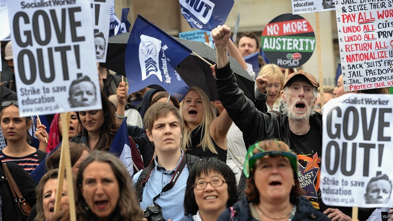 Public sector workers in Trafalgar Square, London, as they take part in the one-day walkout as part of bitter disputes over pay, pensions, jobs and spending cuts.