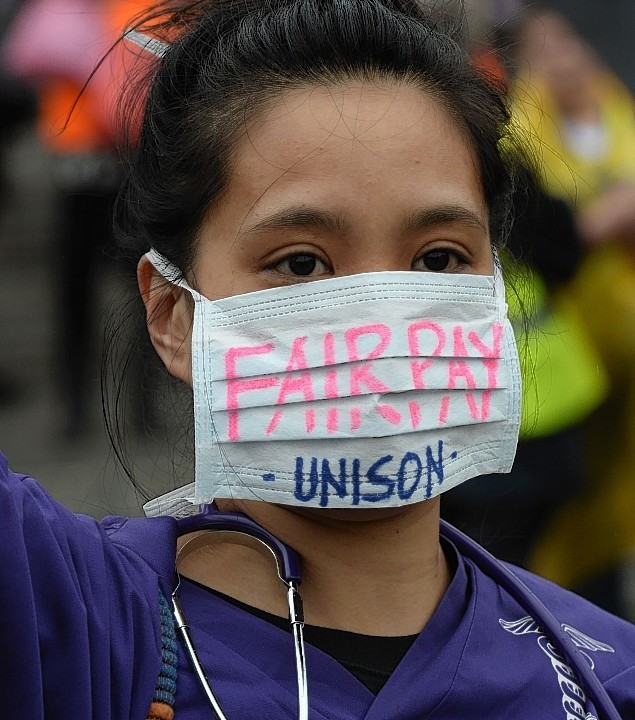 Public sector workers in Trafalgar Square, London, as they take part in the one-day walkout as part of bitter disputes over pay, pensions, jobs and spending cuts.