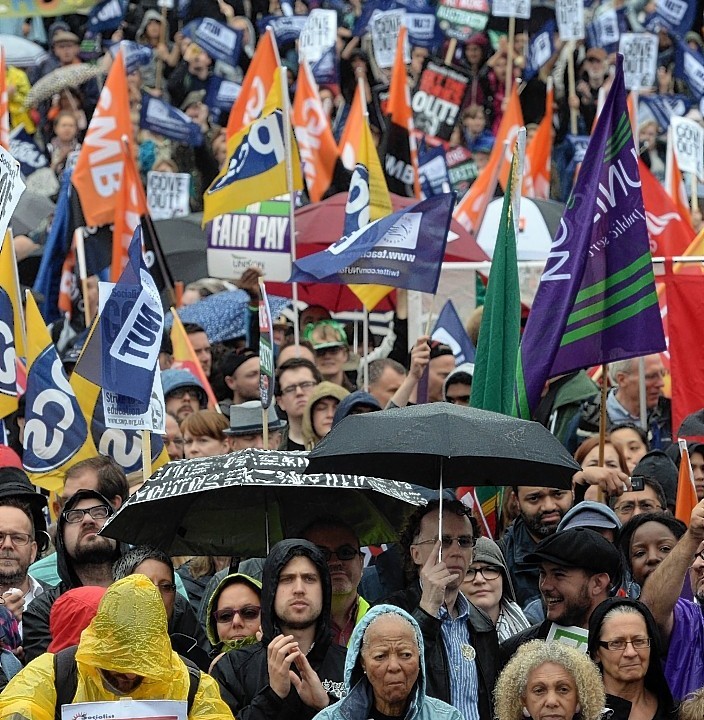 Public sector workers in Trafalgar Square, London, as they take part in the one-day walkout as part of bitter disputes over pay, pensions, jobs and spending cuts.