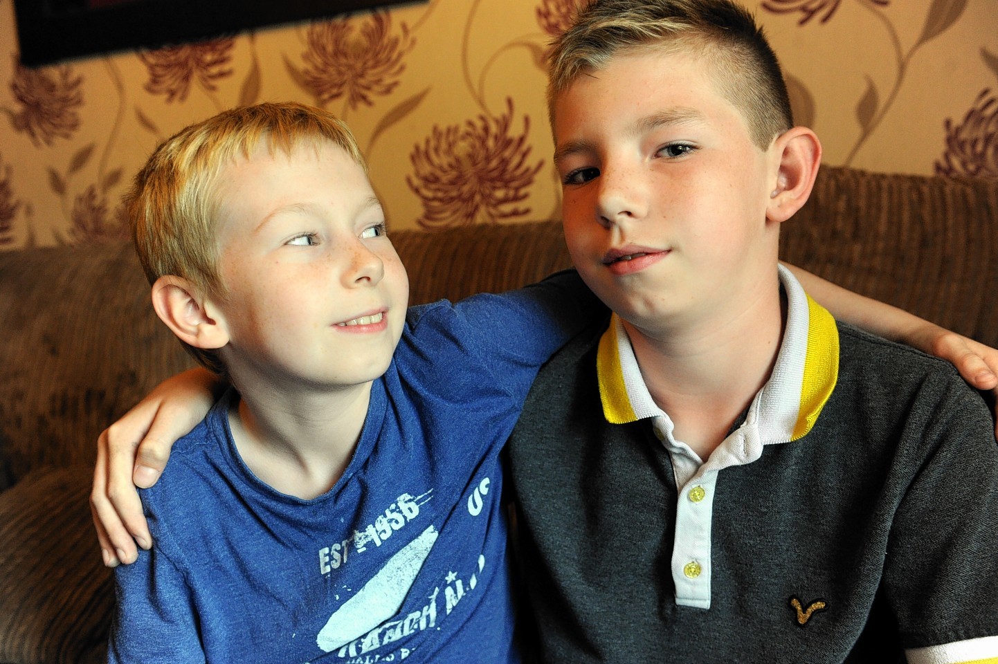 Brothers, Logan Harrison, left, and Tyler Harrison, right, who went back into his bedroom to save his wee brother.