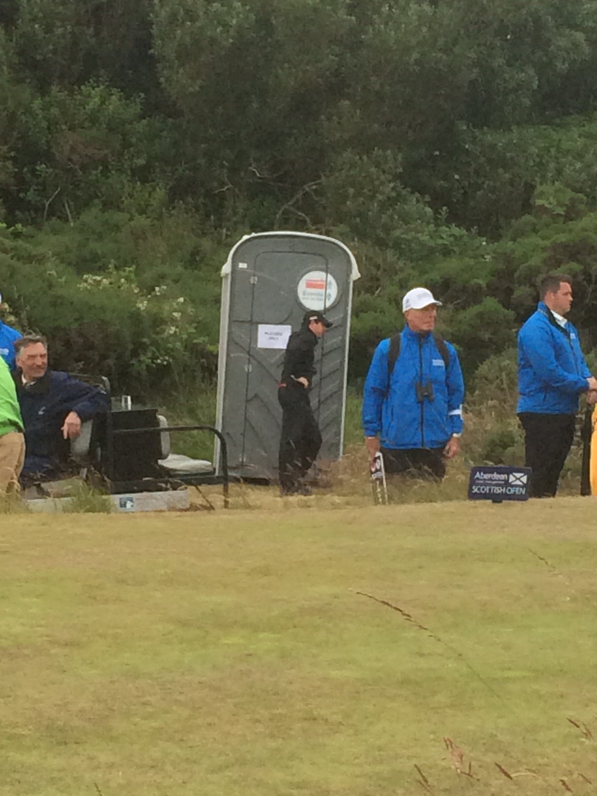 Rory McIlroy locks his playing partner in a portable toilet