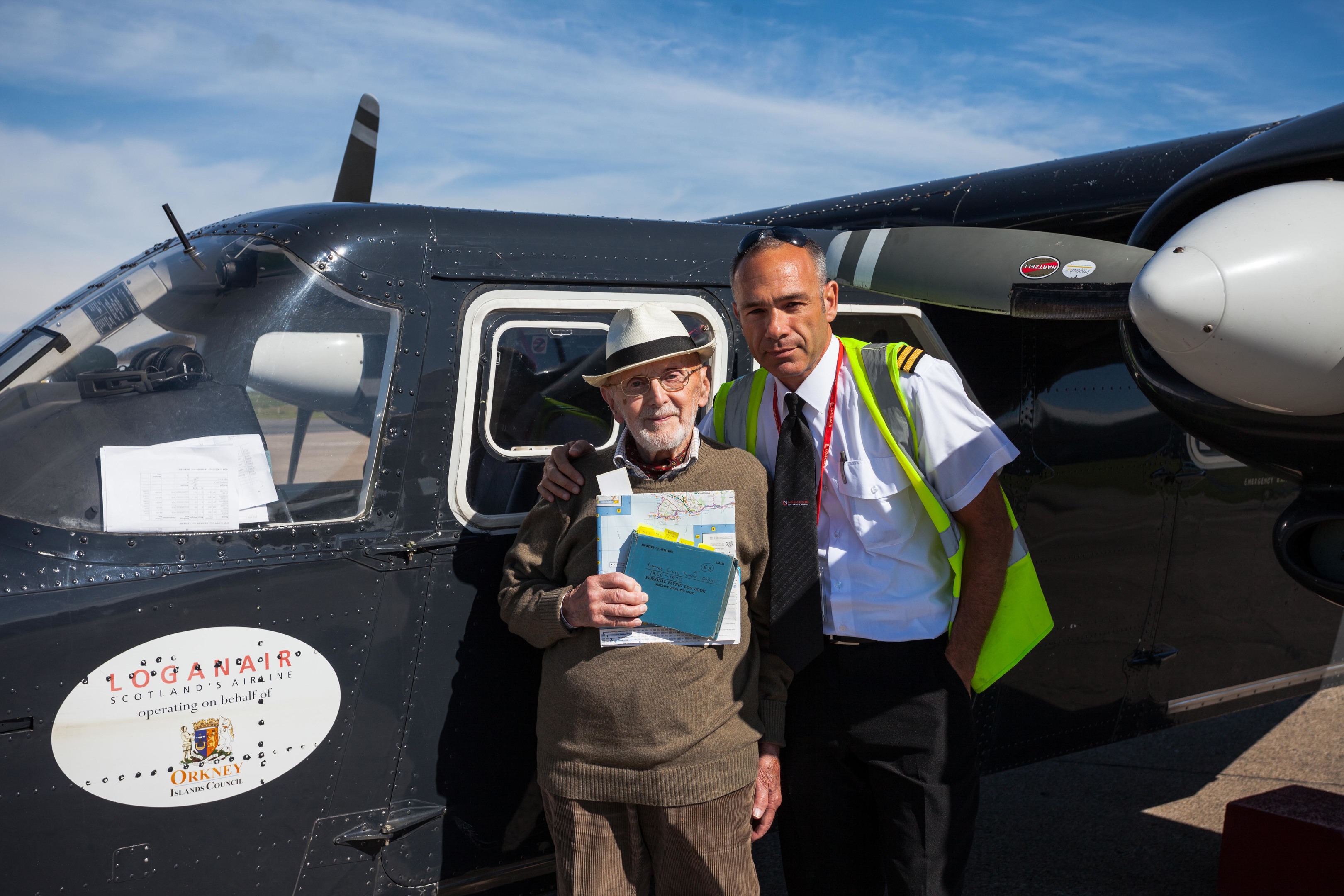 Peter before his flight  with his log book and Loganair pilot Fabio Giovacchini. Photo by Premysl Fojtu