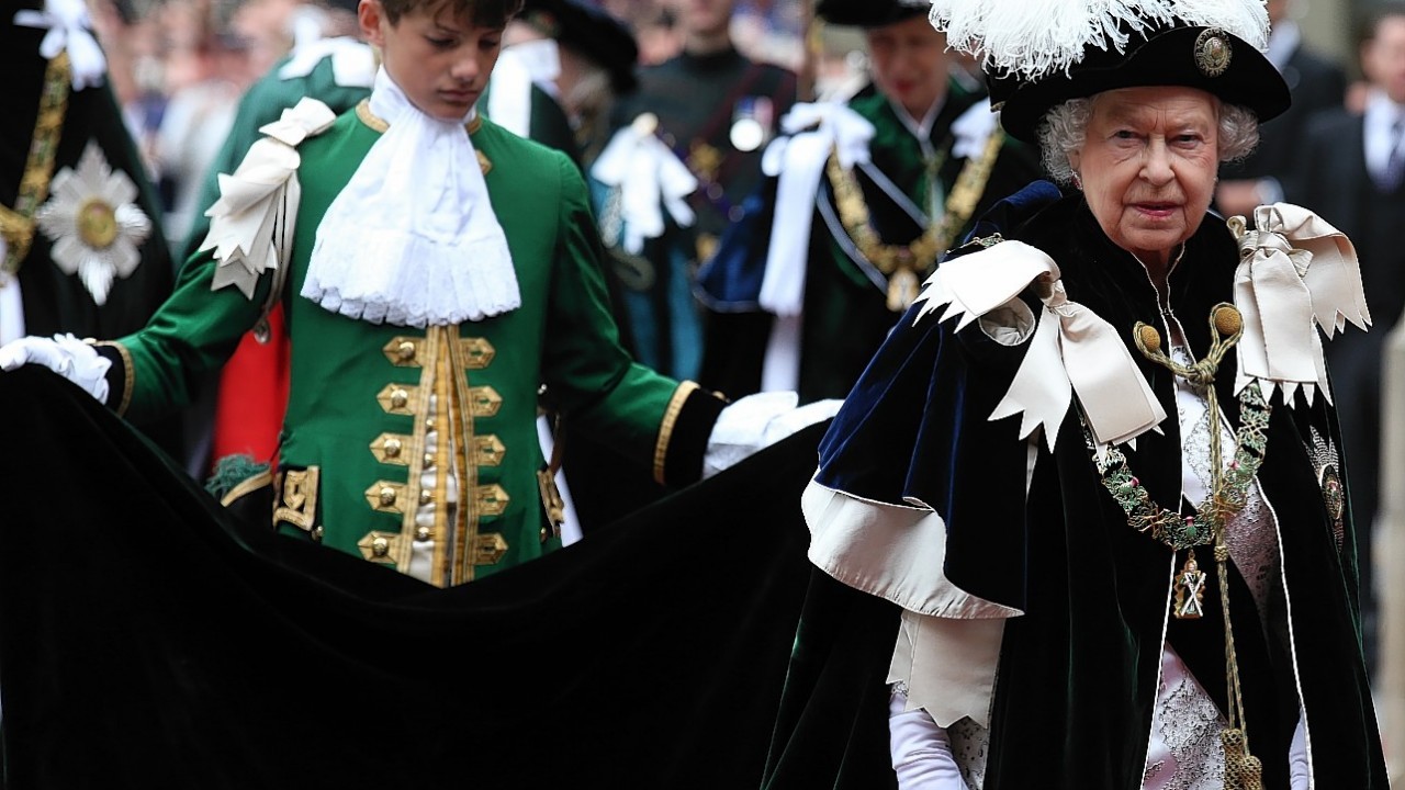 Queen Elizabeth II and the Duke of Edinburgh at St Giles' Cathedral in Edinburgh as they attend the Thistle Service