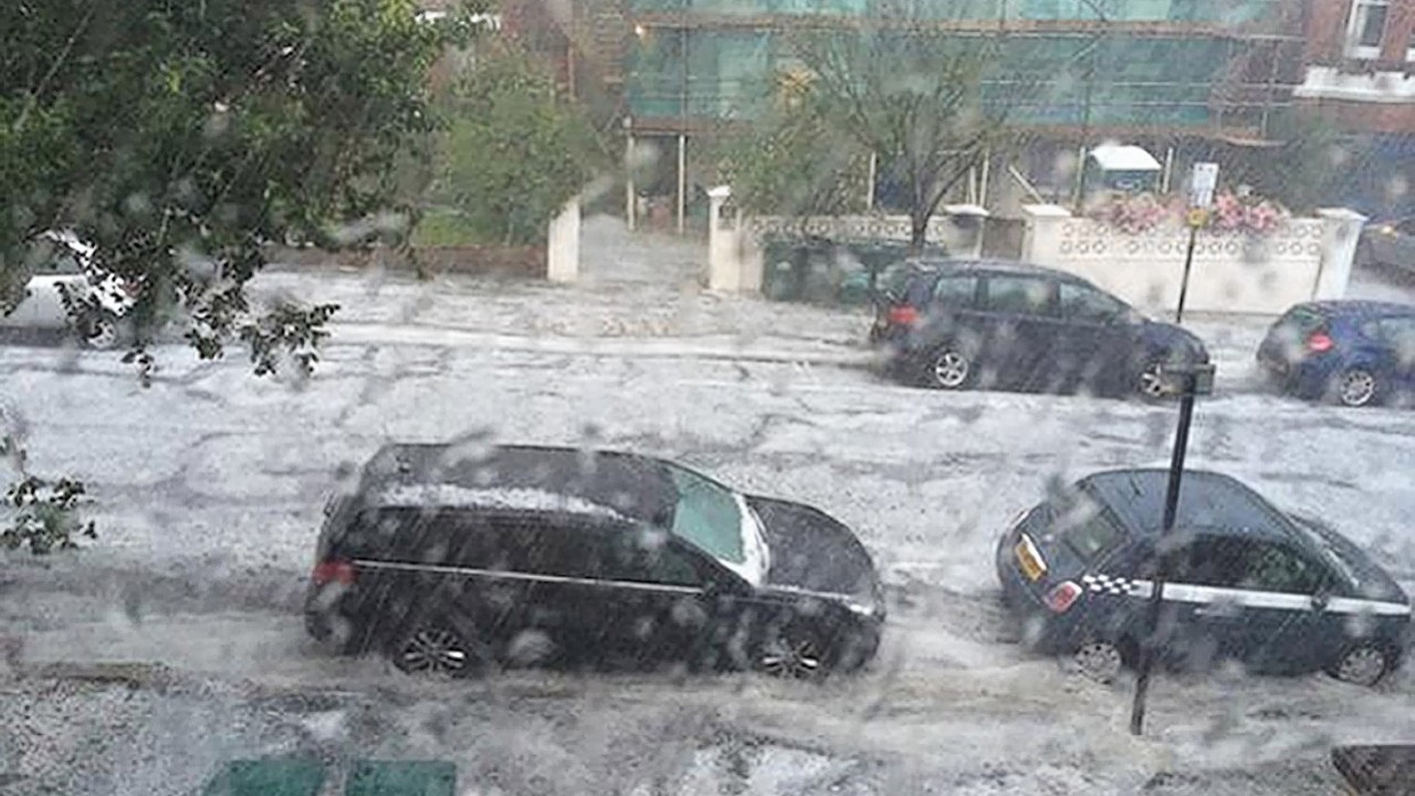 Photo taken from the Twitter feed of @lukewteth with permission of flash flooding in Wilbury Gardens in Hove