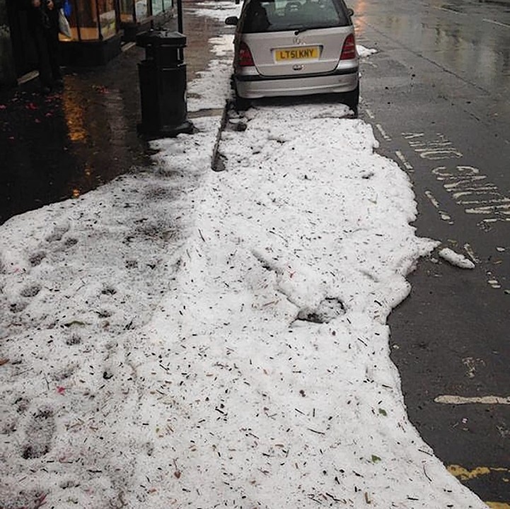 Photo taken from the Twitter feed of @MPS UxbSouth with permission of  the aftermath of a hailstorm in Church Road, Hove as storms hit the Hove, Brighton and Worthing areas of Sussex at the start of the morning rush-hour
