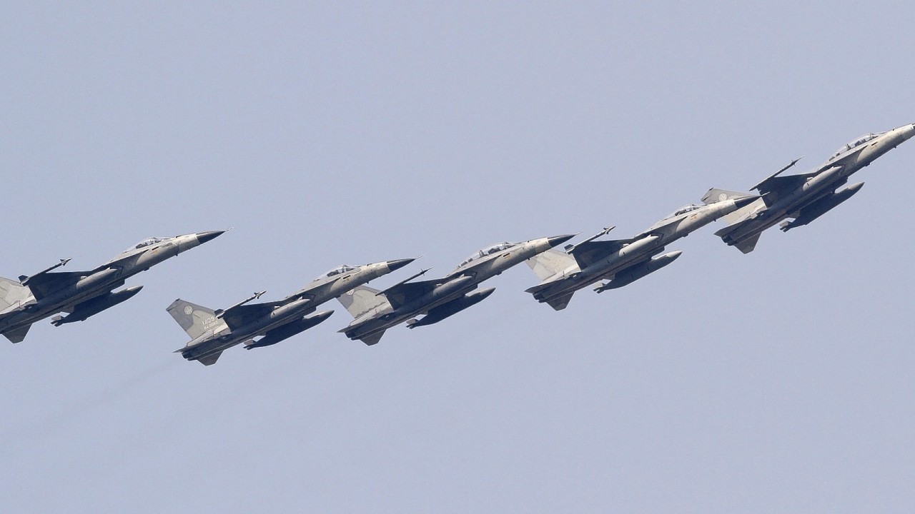 Taiwan's Indigenous Defense Fighters (IDF) fly in close formation over Taichung Air Force base during an air show rehearsal in Taichung, central Taiwan, Thursday, July 17, 2014.