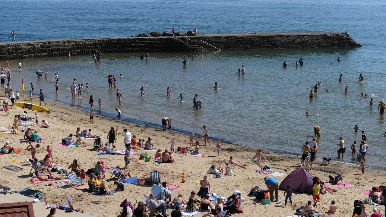 A crowded beach at Cullercoats, North Tyneside as temperatures hit the high 20s