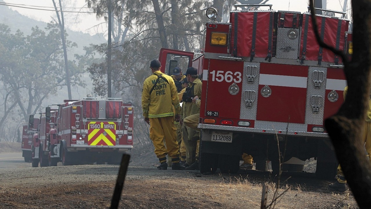 Fire crews from Marin County are shown on Snell Valley Road near Berryessa Estates, Calif.