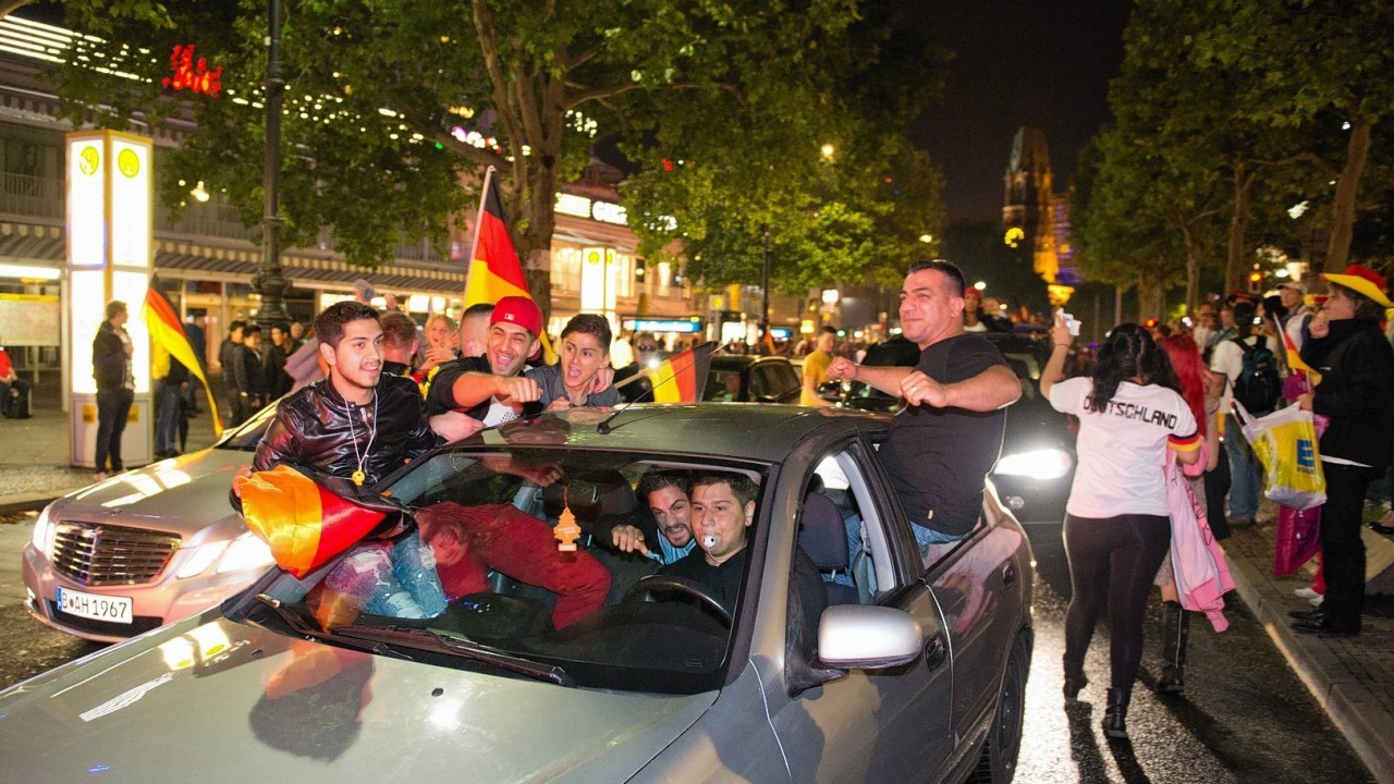 German soccer fans celebrate after the World Cup final between Germany and Argentina in downtown Frankfurt, Germany, early Monday, July 14, 2014