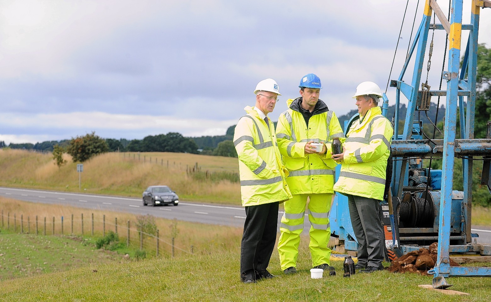 Keith Brown observes the work on the A9