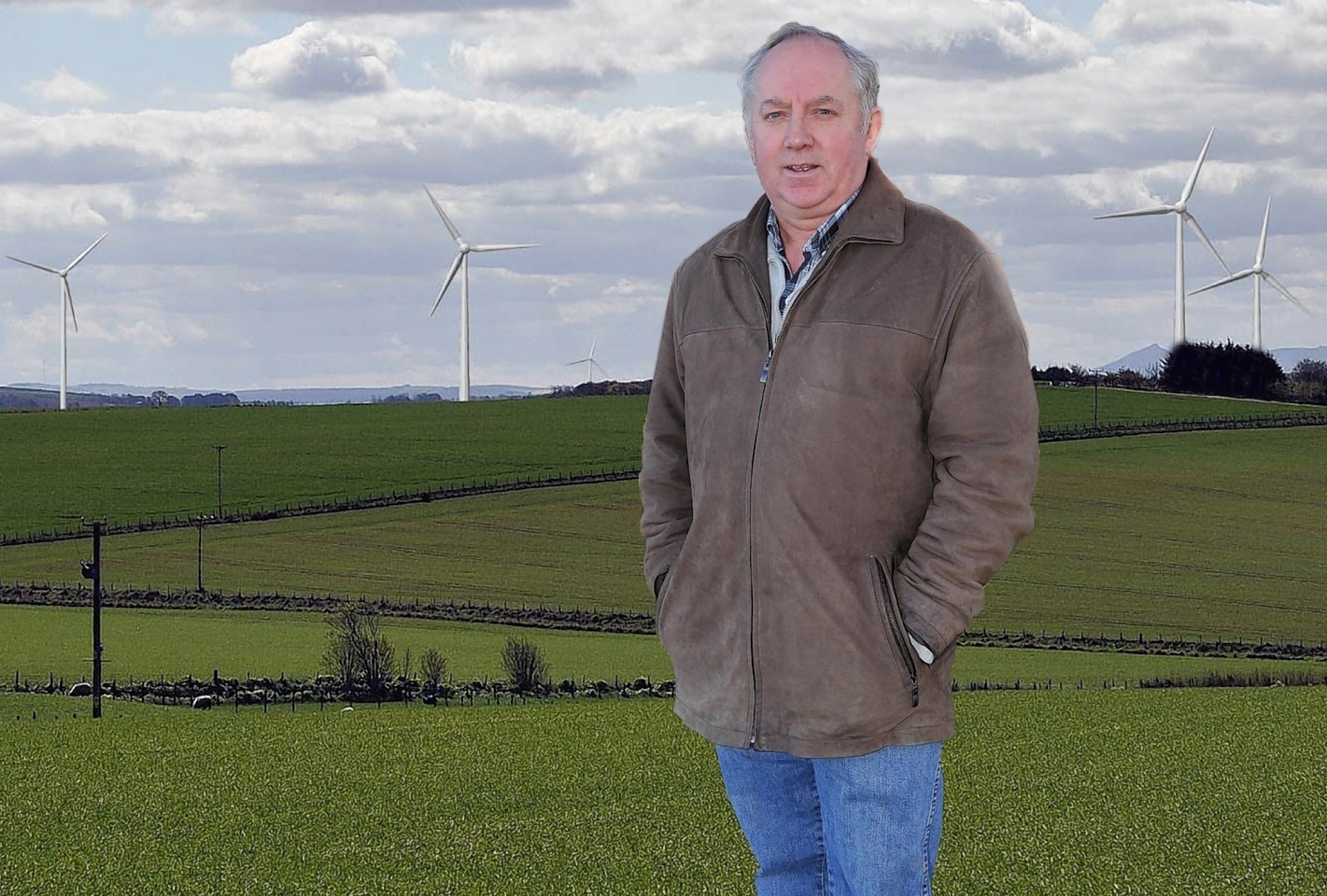 Bob Ritchie infront of an artist impression of the windfarm