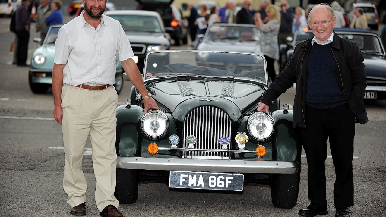 Billy Wison, left, and co-driver, his father, William Wilson, and their 1991 Morgan 4/4