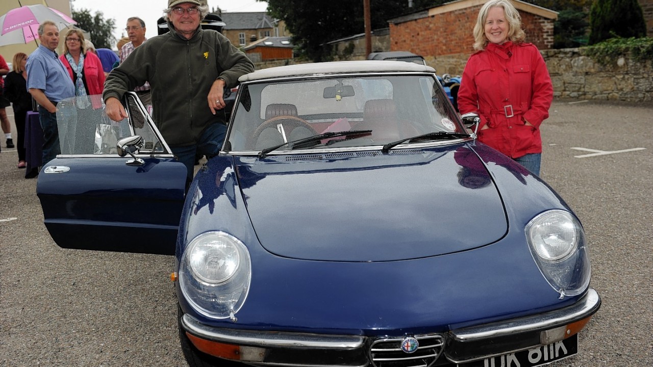 William and Kate Bower and their 1971 Alfa Romeo Spyder.