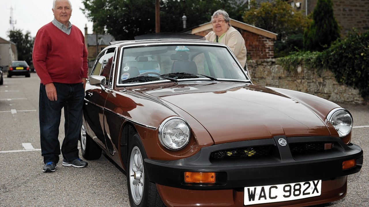 Terry and Elyse Minshull and their 1980 MGB GT