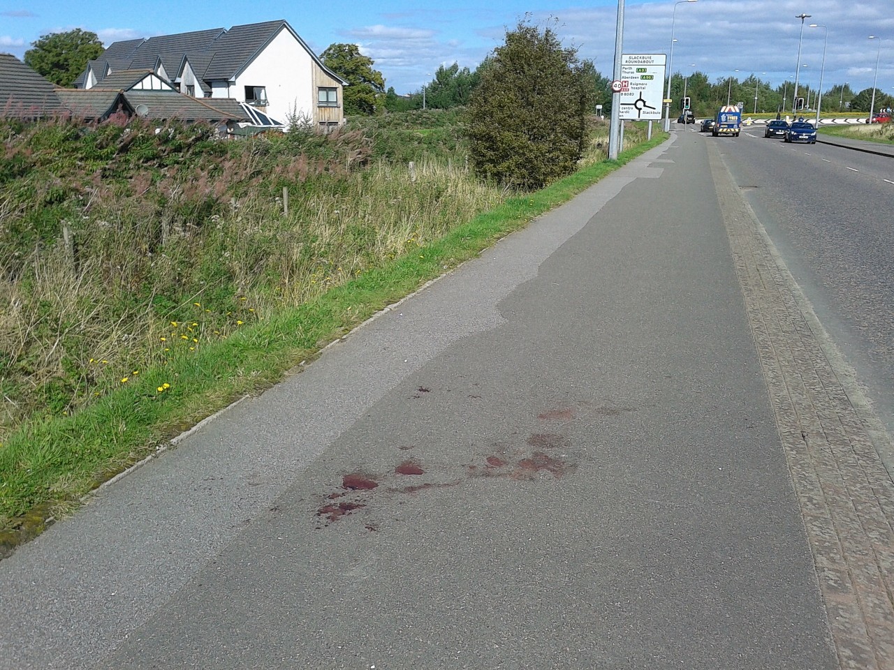 Blood left on the road following the incident in Inverness