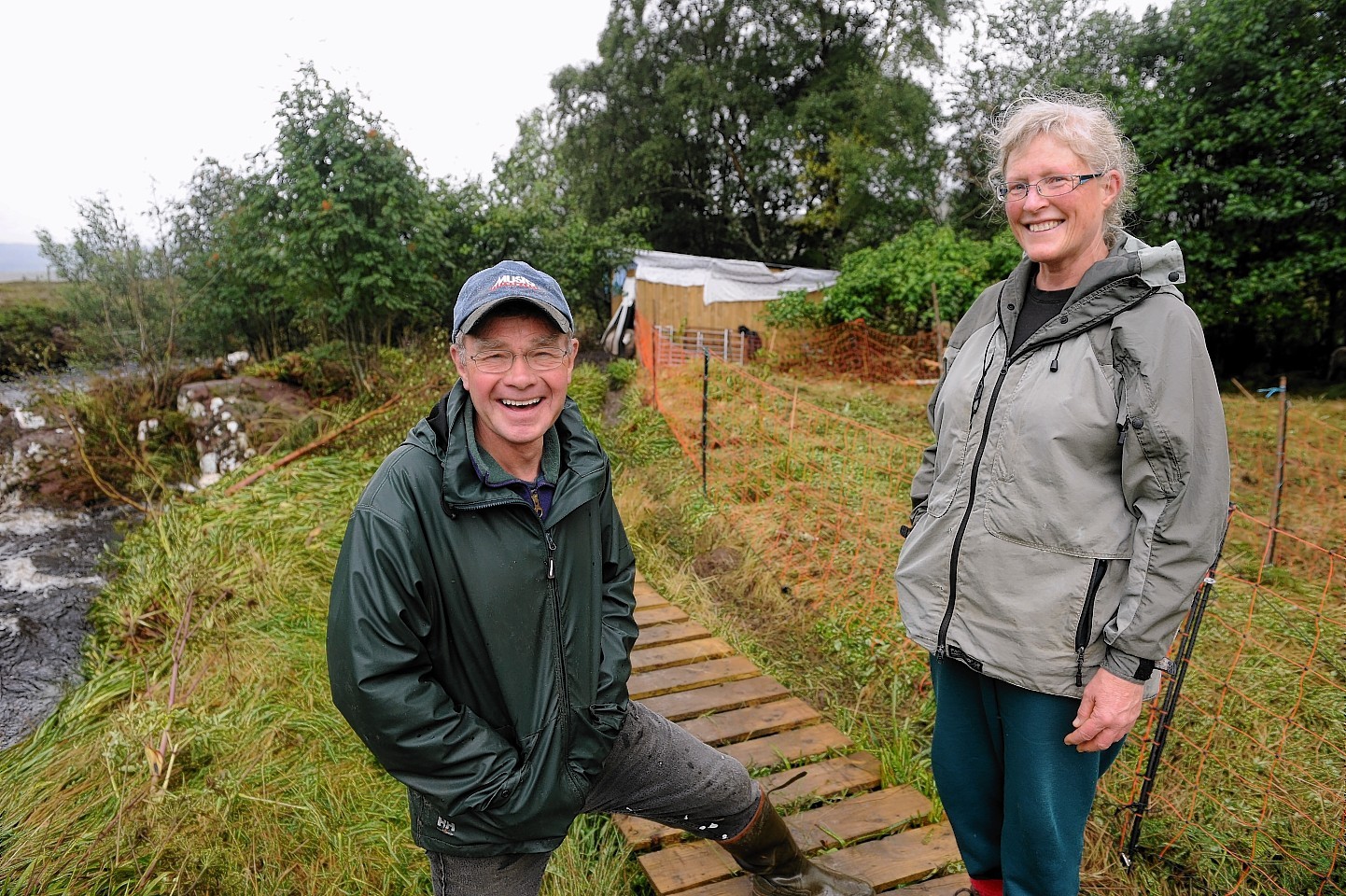 Meryl Carr and her husband in front of the shed where she became trapped