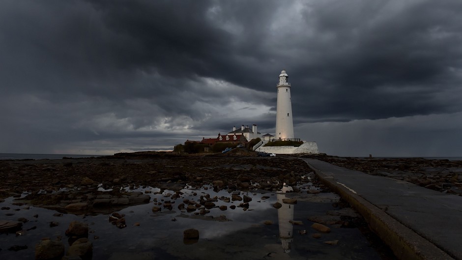 Storm clouds gathering over St. Mary's lighthouse in Whitley Bay, with more rain forecast for Bank Holiday Monday