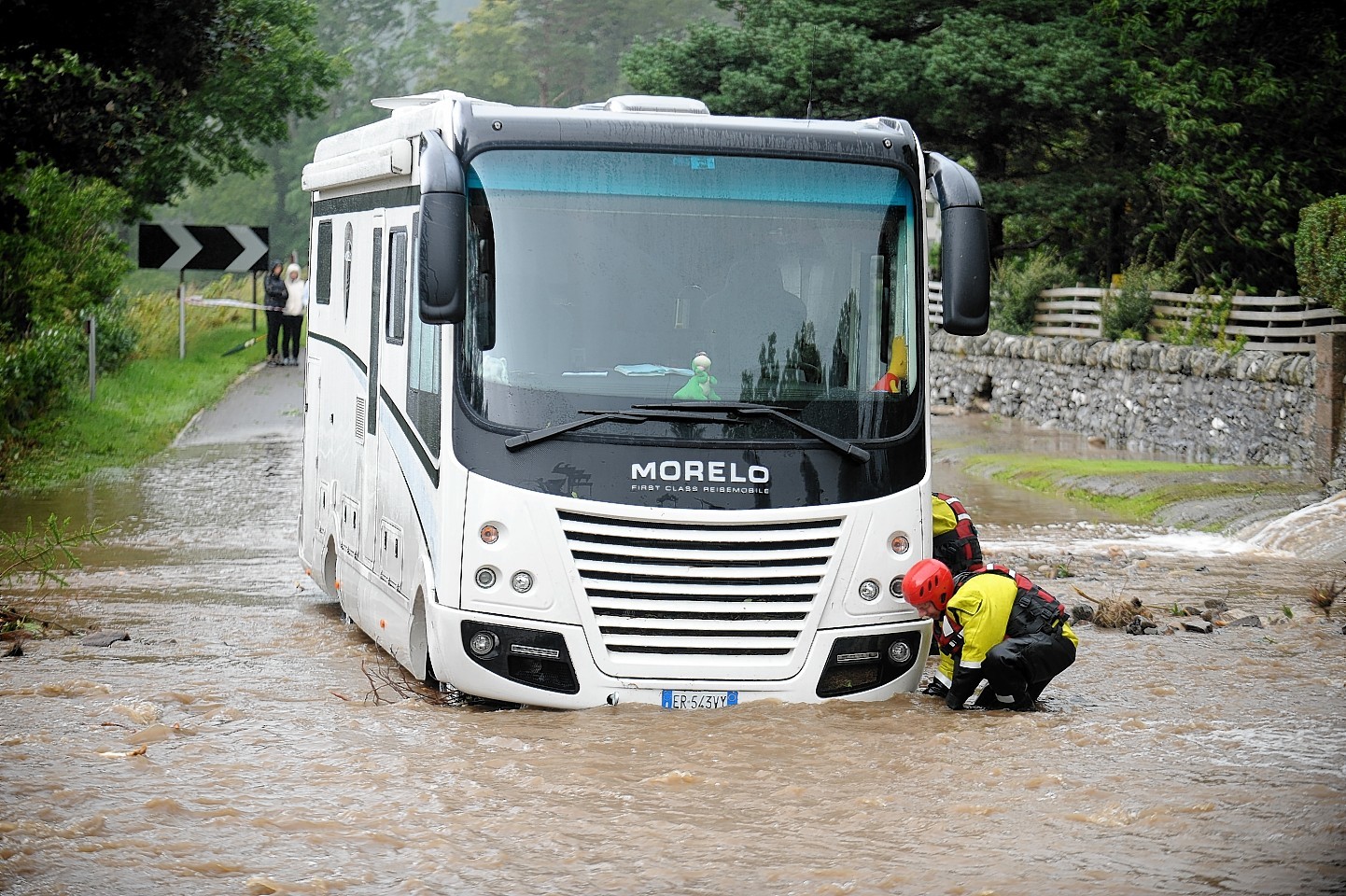 A bus stuck in flooding near Ullapool