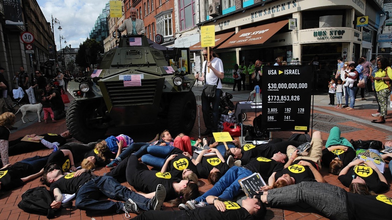 Volunteers take part in a Die in on Grafron Street, Dublin, where Amnesty International called on the US government to immediately end its ongoing deliveries of large quantities of arms to Israel, which are fuelling serious violations of international law in Gaza.
