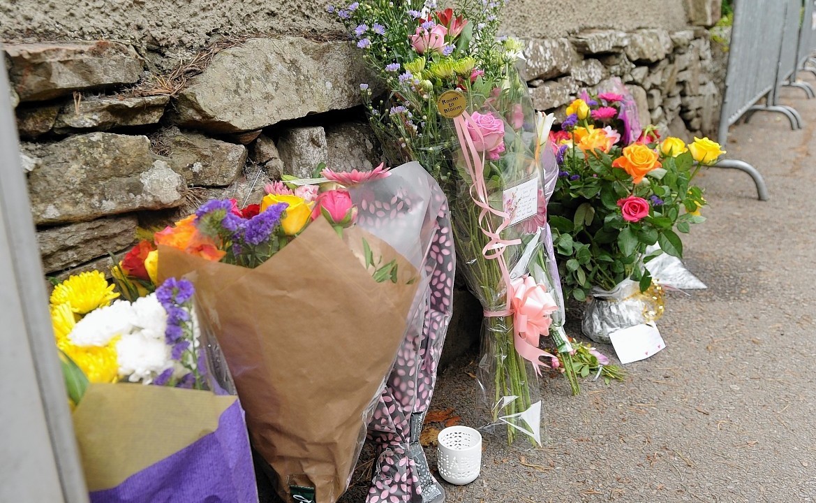 Floral tributes and messages of sympathy for Charlotte Hornby at the scene close to where her body was found on Sunday evening close to Island Bank Road, Inverness.