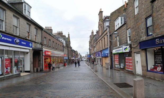 The images are located in business windows across the town centre.