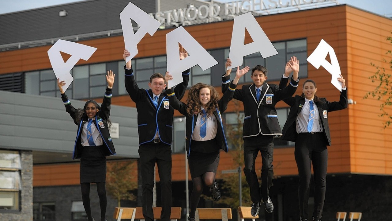 Pupils at Eastwood High, Newton Mearns, outside Glasgow, August 5, 2014, got straight As at Highers