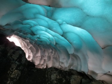 The underside of an almost translucent snow tunnel on Ben Nevis