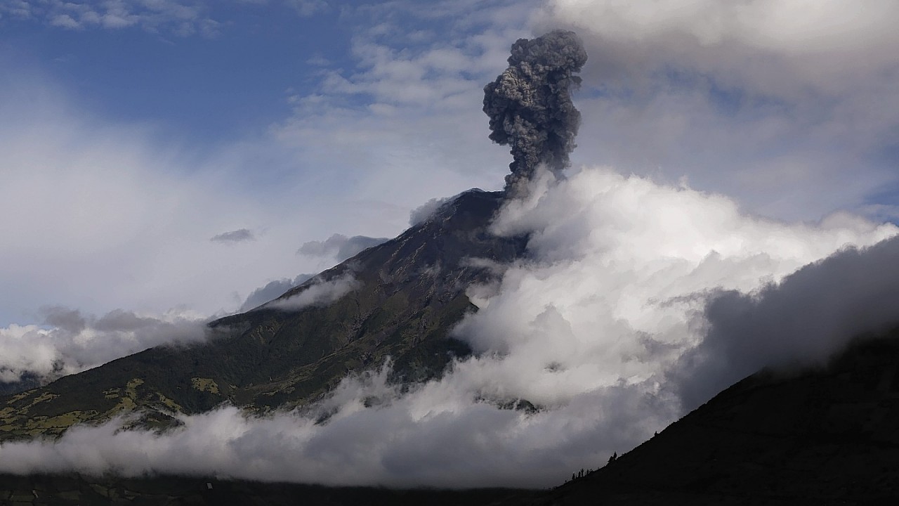 The Tungurahua volcano blows steam and ash, seen from El Tingue, Ecuador, Thursday, Aug. 28, 2014
