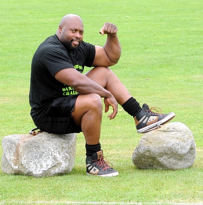World Strongest Man competitor Mark Felix is attempting to lift and carry the Dinnie Stones at the Aboyne Highland Games