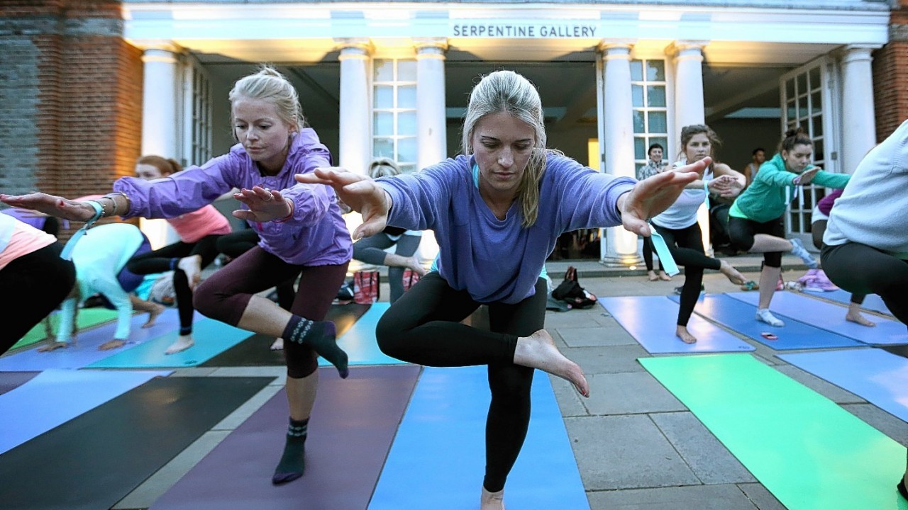 Lululemon Athletica hosts a mass yoga class at the Serpentine Pavilion, Hyde Park, London as a celebration of summer